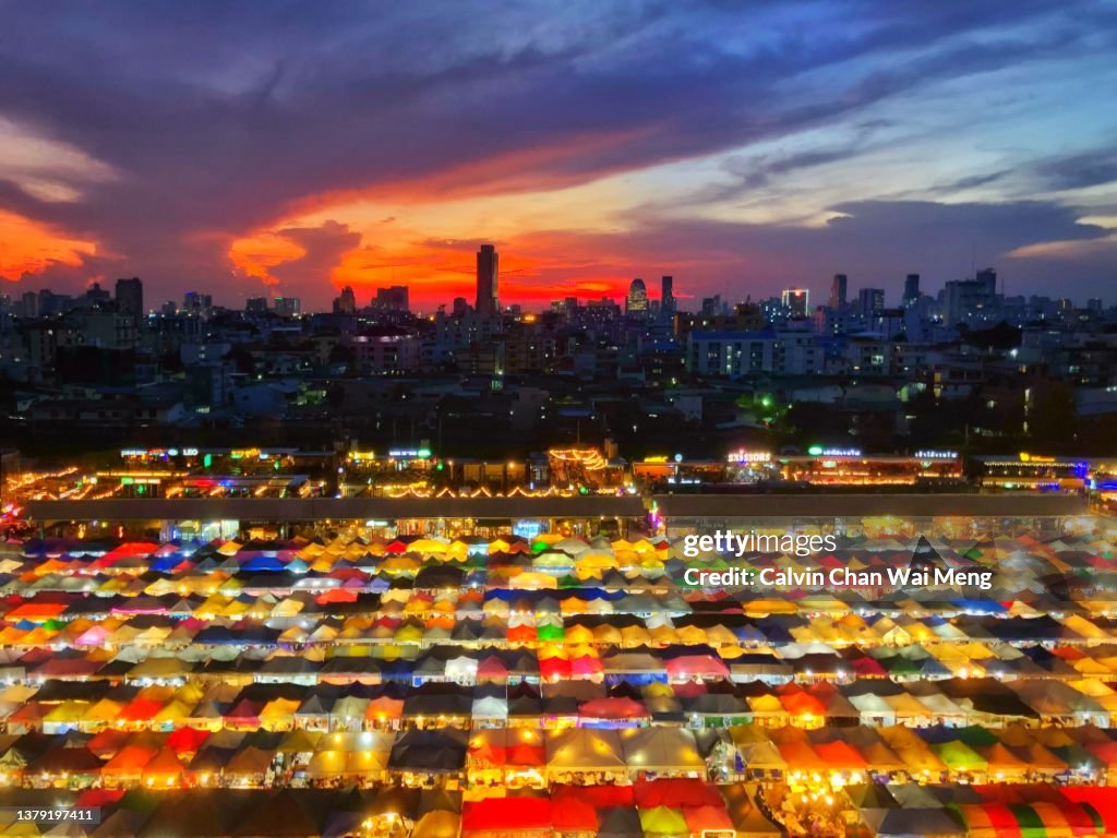 Ratchada Rot Fai Train Market after sunset in Bangkok, Thailand