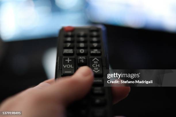 watching tv from the bed - hands resting stock pictures, royalty-free photos & images