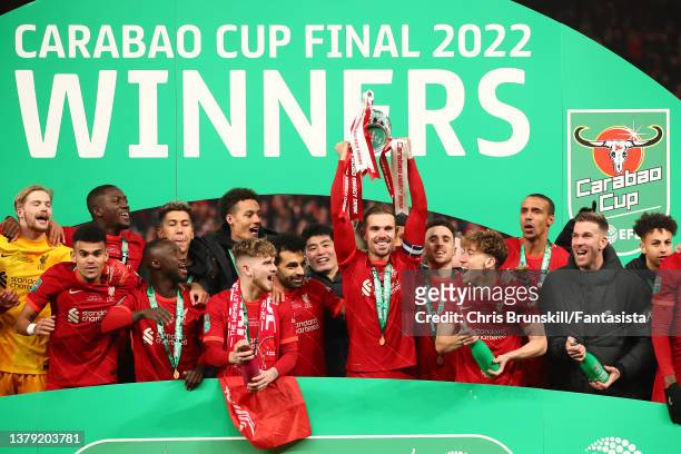 Jordan Henderson of Liverpool lifts the trophy following the Carabao Cup Final match between Chelsea and Liverpool at Wembley Stadium on February 27,...