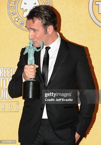 Actor Jean Dujardin poses in the press room during the 18th Annual Screen Actors Guild Awards at The Shrine Auditorium on January 29, 2012 in Los...