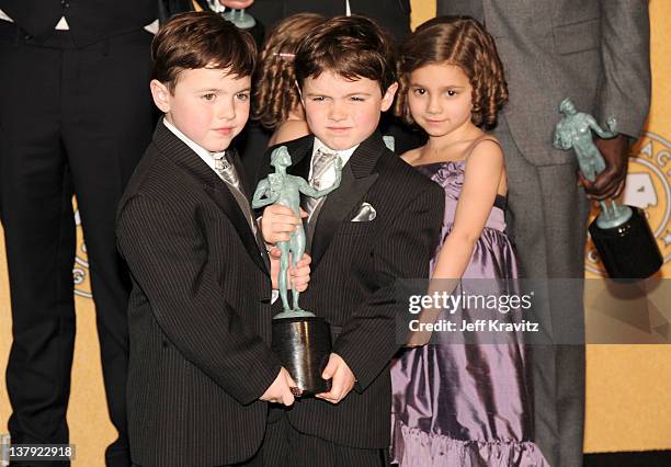 Actors Connor Noon, Brady Noon, Lucy Gallina pose in the press room during the 18th Annual Screen Actors Guild Awards at The Shrine Auditorium on...