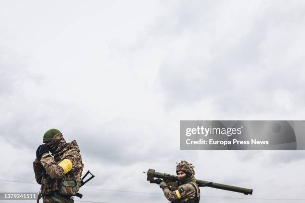 Ukrainian army soldier takes aim with an anti-aircraft missile, March 4 in Irpin, Ukraine. Ukraine has been in the midst of a war for nine days...