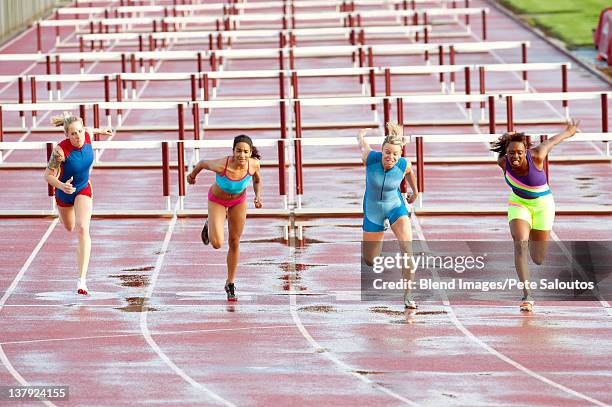 runners crossing finish line in race - athlete defeat stock pictures, royalty-free photos & images