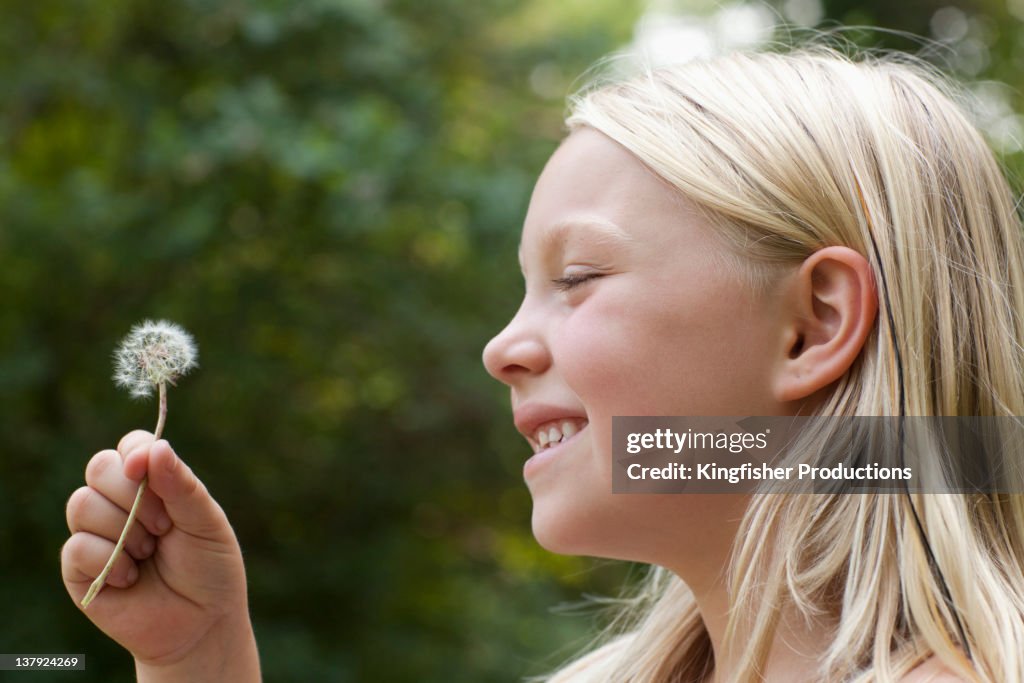 Caucasian girl holding flower