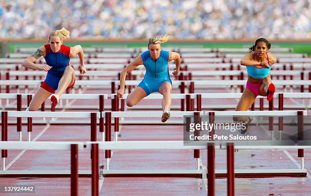 runners jumping hurdles in race - championship day three stock pictures, royalty-free photos & images