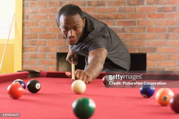 african american man playing pool - pool cue sport stock pictures, royalty-free photos & images