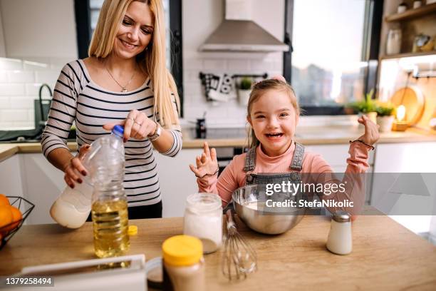 cooking for mum - making pancakes stock pictures, royalty-free photos & images