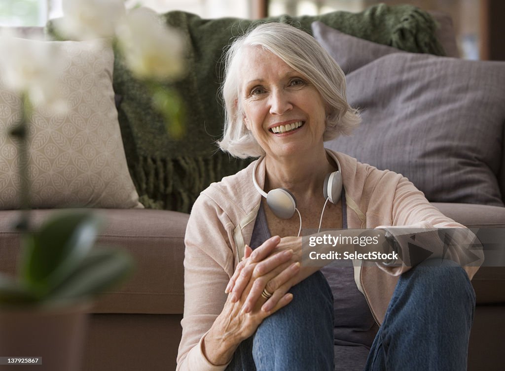 Portrait of woman sitting with headphones