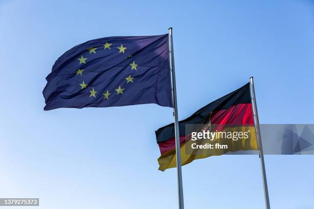 german and eu-flag - german flag wallpaper stock-fotos und bilder