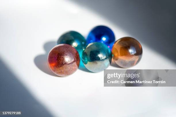 marbles isolated on white background - water walking ball stock pictures, royalty-free photos & images