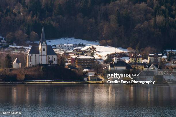 view of maria wörth town from the opposite side of the lake wörth - wörthersee, carinthia region, austria - ヴェルターゼー ストックフォトと画像