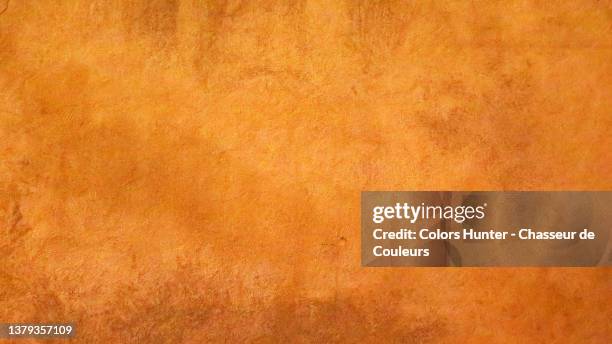 wall painted and weathered in yellow and brown in paris - gold patina stock pictures, royalty-free photos & images