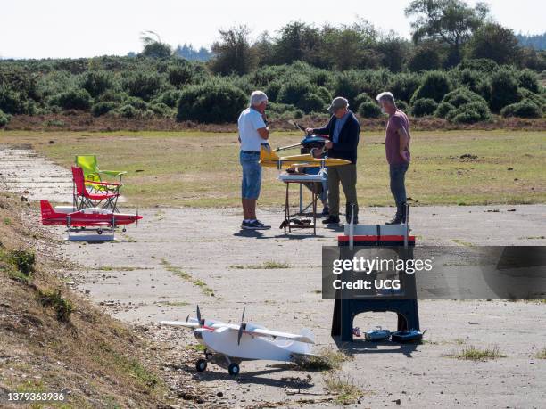 Model flying club on the runway at RAF Beaulieu an old WWII airfield, The New Forest, Hampshire, UK.