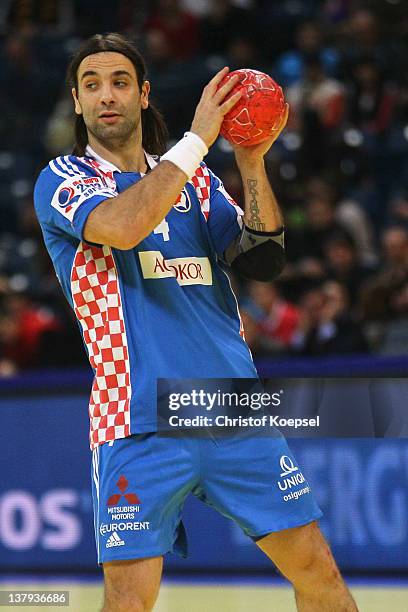 Ivano Balic of Croatia passes the ball during the Men's European Handball Championship bronze medal match between Croatia and Spain at Beogradska...