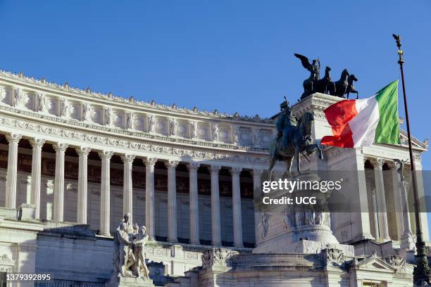 Flying Italian flag. Monument to king Victor Emmanuel II, and monument of the Unknown Soldier at Venice Square. Vittorio Emanuele II. Rome, Italy,...