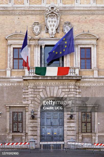 The French Embassy in Rome displays also the Italian flag showing solidarity during Coronavirus lockdown. Farnese Square. Rome at the time of Covid...