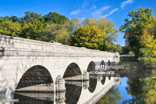 Five Arch Bridge crossing Virginia Water Lake in Windsor Great Park in Surrey. Designed by Sir Jeffry Wyatville and completed in 1827. .