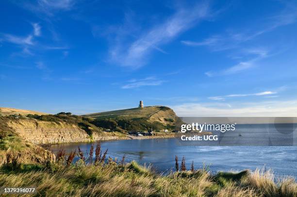 Kimmeridge Bay and Clavell Tower on top of Hen Cliff, Isle of Purbeck, Jurassic Coast World Heritage Site, Dorset, England, UK.