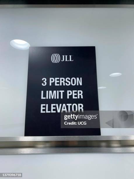 Person Limit per Elevator sign in office building, Midtown, New York City.
