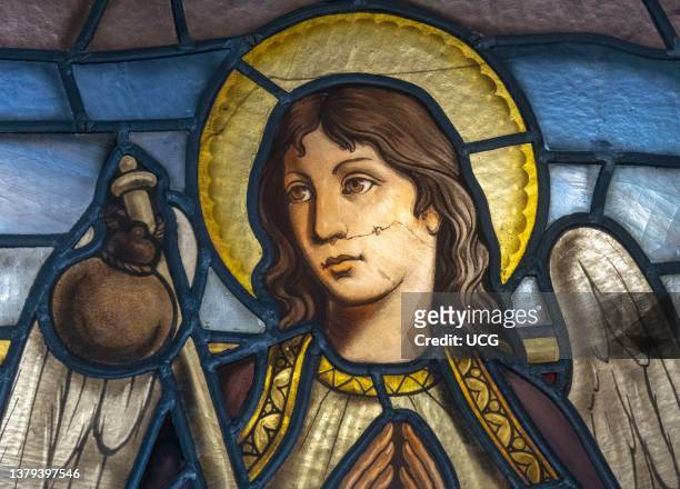 Stained glass window featuring the Archangel Raphael who is said to guard travelers. La Rabida Monastery, Palos de la Frontera, Huelva Province,...