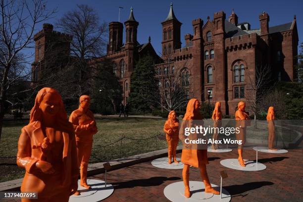 Life-size 3D-printed statues honoring women in STEM are seen at the Enid A. Haupt Garden outside the Smithsonian Castle March 4, 2022 in Washington,...