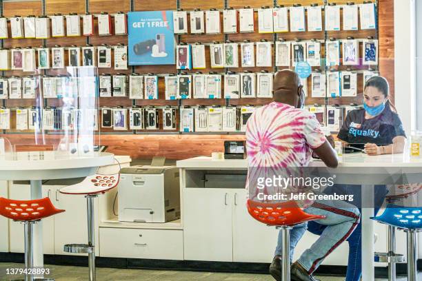 Miami, Surfside, Florida, AT&T smartphone store, salesperson with customers.