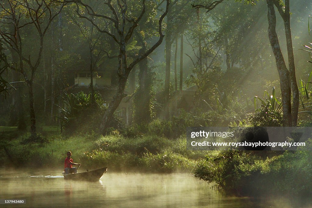 Boat man enjoys serenity of Situgunung lake