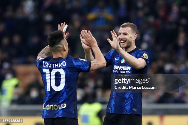 Edin Dzeko of FC Internazionale celebrates with teammate Lautaro Martinez after scoring their team's fifth goal during the Serie A match between FC...
