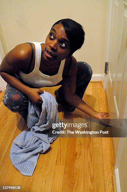 Kyon-Teka Adams inside her apartment on Meigs Place NE, Washington DC on January 24, 2012. Kyon-Teka is talking about rodents, raccoons and other...