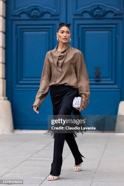 Pritika Swarup, wearing a brown blusa, white shoes and black fringes pants, is seen on the streets of Paris, during Paris Fashion Week - Womenswear...