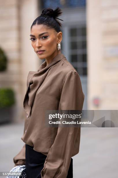 Pritika Swarup, wearing a brown blusa, white shoes and black fringes pants, is seen on the streets of Paris, during Paris Fashion Week - Womenswear...