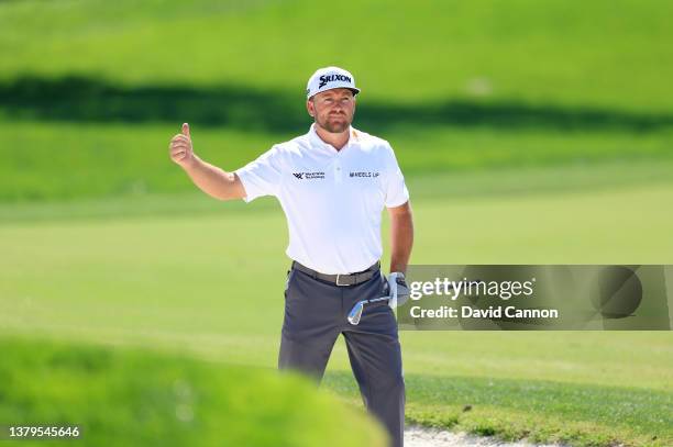 Graeme McDowell of Northern Ireland plays his second shot on the par 4, first hole during the second round of the Arnold Palmer Invitational...