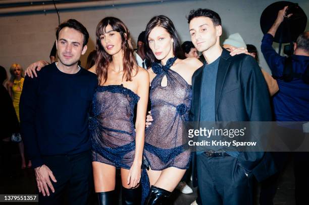 Arnaud Vaillant, Mica Argañaraz, Bella Hadid and Sebastien Meyer pose backstage during to the Coperni Womenswear Fall/Winter 2022-2023 show as part...