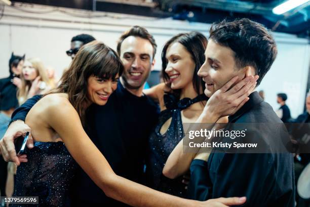 Arnaud Vaillant, Mica Argañaraz, Bella Hadid and Sebastien Meyer pose backstage during to the Coperni Womenswear Fall/Winter 2022-2023 show as part...