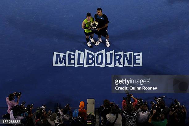 Bethanie Mattek-Sands of the United States of America and Horia Tecau of Romania pose with the winners trophy after defeating Elena Vesnina of Russia...