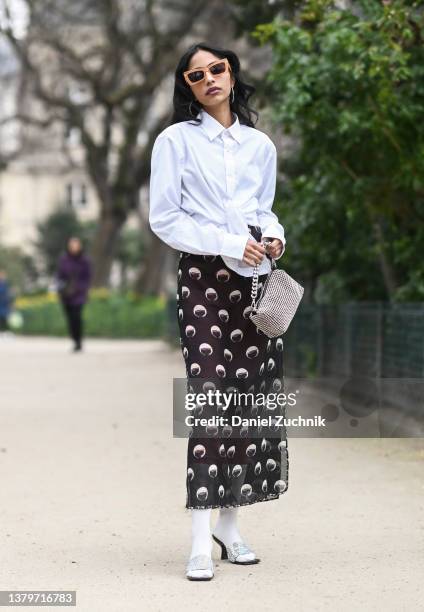 Malvika Sheth is seen wearing a Louis Vuitton dress, Future Relics leggings, mens button down shirt and Byfar shoes outside the Loewe show during...