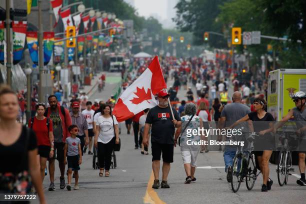 Revelers on Wellington Street during Canada Day in Ottawa, Ontario, Canada, on Saturday, July 1, 2023. The main events for the celebration will come...