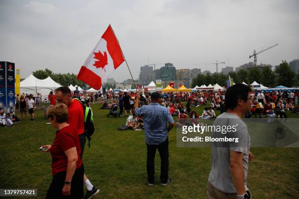 Revelers near the main stage at LeBreton Flats during Canada Day in Ottawa, Ontario, Canada, on Saturday, July 1, 2023. The main events for the...