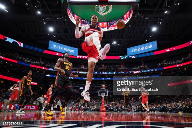 Daniel Gafford of the Washington Wizards celebrates after a dunk against the Atlanta Hawks during the first half at Capital One Arena on March 4,...