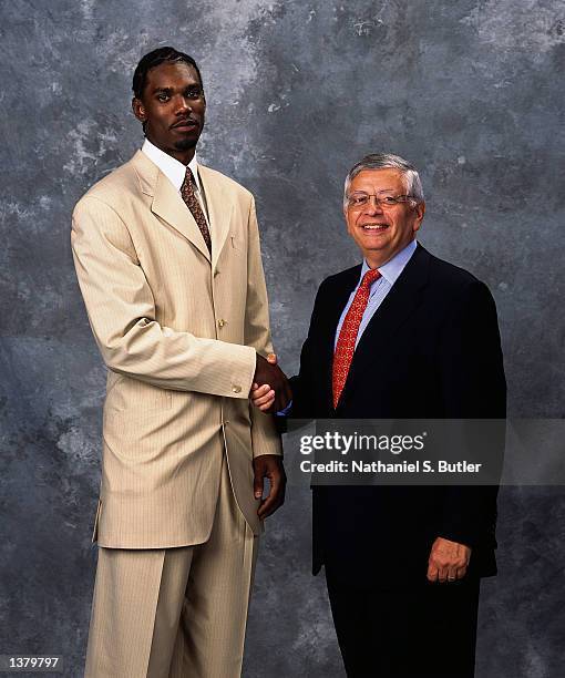 Qyntel Woods of the Portland Trailblazers and NBA Commissioner David Stern pose for a portrait during the 2002 NBA Draft at The Theater At Madison...
