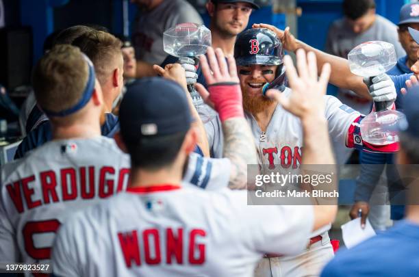 Justin Turner of the Boston Red Sox celebrates his home run against the Toronto Blue Jays during the ninth inning in their MLB game at the Rogers...