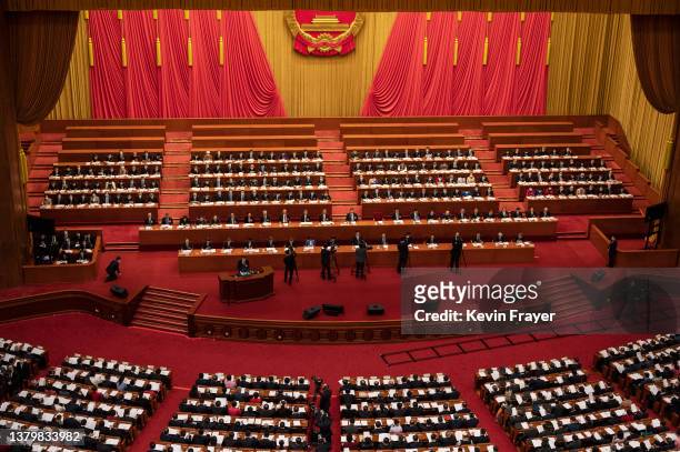 Chinese Premier Li Keqiang speaks from the podium as President Xi Jinping, centre, and members of the government look on at the opening session of...