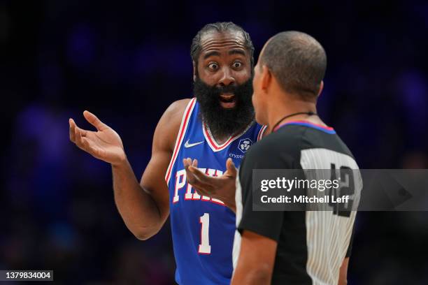 James Harden of the Philadelphia 76ers talks with referee Eric Lewis against the Cleveland Cavaliers in the first half at the Wells Fargo Center on...