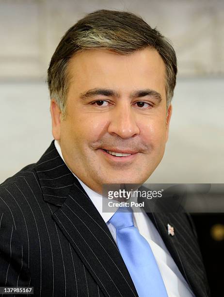 Georgian President Mikheil Saakashvili meet with U.S. President Barack Obama after a bilateral meeting in the Oval Office of the White House January...