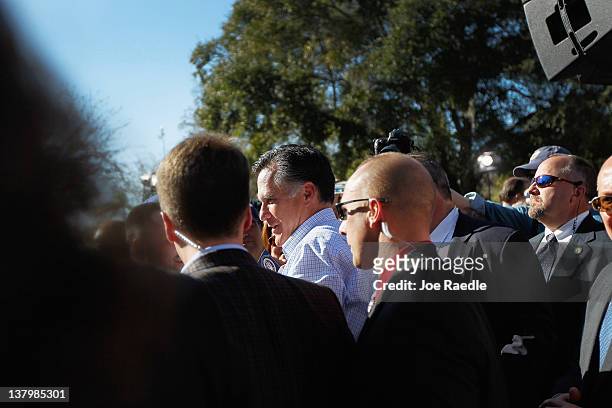 Republican presidential candidate and former Massachusetts Gov. Mitt Romney greets people during a rally with supporters at Pioneer Park on January...