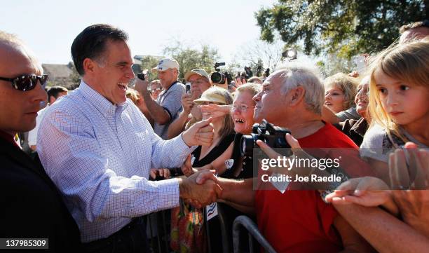 Republican presidential candidate and former Massachusetts Gov. Mitt Romney greets people during a rally with supporters at Pioneer Park on January...