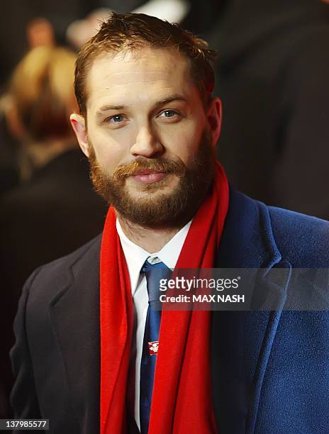 British actor Tom Hardy arrives for the British Premiere of the film "This Means War", in London, on January 30, 2012. AFP Photo / Max Nash