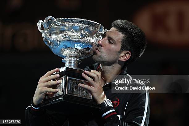 Australian Open: Closeup of Serbia Novak Djokovic victorious, kissing Norman Brookes Challenge Cup trophy after winning Men's Final match vs Spain...