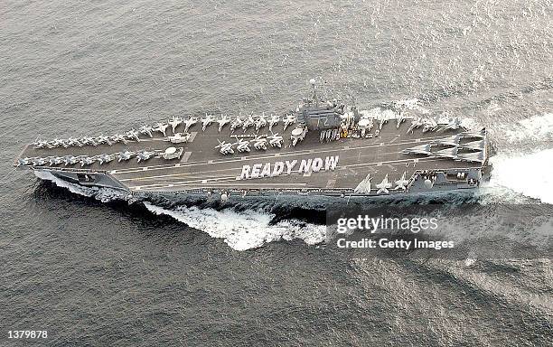 Responding to U.S. President George W. Bush's admonition to "Be Ready," sailors spell out their response on the flight deck of the USS Abraham...