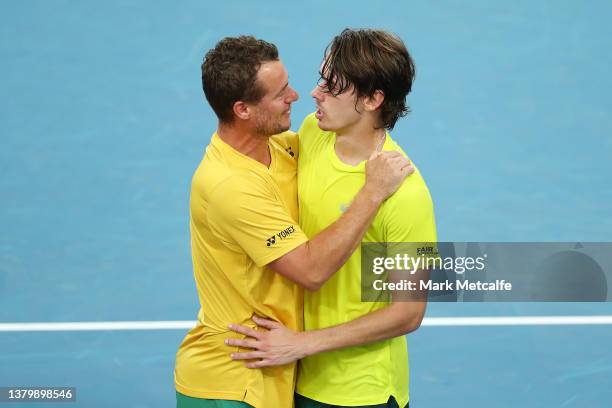 Alex de Minaur of Australia celebrates with Australian Davis Cup captain Lleyton Hewitt after winning his singles match against Marton Fucsovics of...